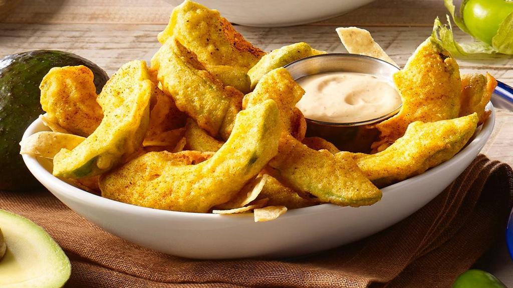 Avocado Fries · Fresh avocado slices tempura-battered and fried to order. Served with a side of creamy red chile sauce.