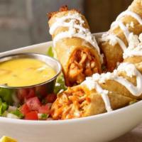 Chicken Flautas · Two hand-rolled yellow corn tortillas filled with chicken tinga and fried golden. Topped wit...