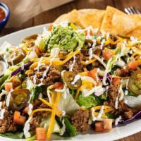 Grande Taco Salad · Seasoned ground beef or chicken tinga on a crisp blend of lettuce & shredded cabbage, mixed ...