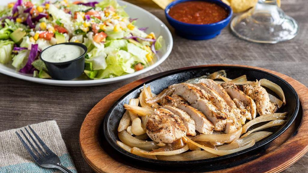 Fajita Salad · Mesquite-grilled chicken or steak and onions, with a crisp blend of lettuce & shredded cabbage, pico de gallo, roasted corn, fresh avocado and queso freso.