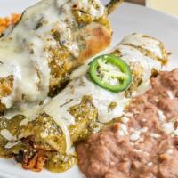 New Mexico · Cheese chile relleno and carnitas enchilada, topped with salsa verde. Served with Mexican ri...