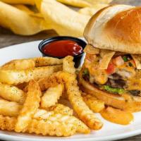 Loaded Queso Burger · Our Tex-Mex burger loaded with fresh guacamole, pico de gallo, tortilla strips pickled jalap...