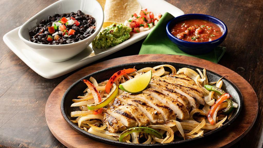 Border Smart Chicken · 650 cal. Mesquite-grilled chicken with sautéed onions and red and green bell peppers. Served with black beans, white corn tortillas, pico de gallo, and guacamole.