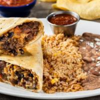 The Big Bordurrito® · A HUGE serving of fajita chicken or steak wrapped in a seared flour tortilla with Mexican ri...