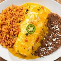 Lunch Chimichanga · Our Lunch Burrito fried crispy and smothered with chile con carne, sour cream sauce, salsa v...