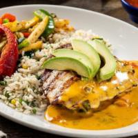 Grilled Queso Chicken · Mesquite-grilled chicken breast topped with our signature queso and fresh sliced avocado. Se...