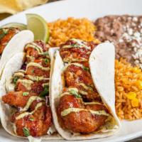 Honey-Chipotle Shrimp Tacos · Crispy-fried shrimp tossed in honey-chipotle sauce with cilantro, spicy avocado ranch and sh...