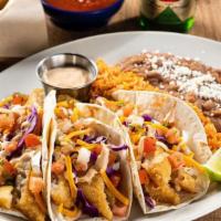 Dos Xx® Fish Tacos · Dos XX beer-battered fish, creamy red chile sauce, shredded cabbage, mixed cheese and pico d...