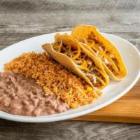 Kids Taco Plate · Two soft or crispy tacos with seasoned ground beef and mixed cheese. Served with Mexican ric...