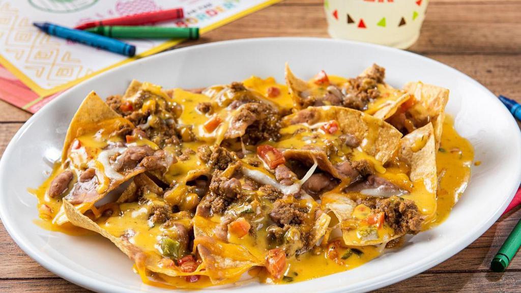 Big Kid Nachos · Big nacho chips topped with refried beans, seasoned ground beef, mixed cheese and our signature queso.