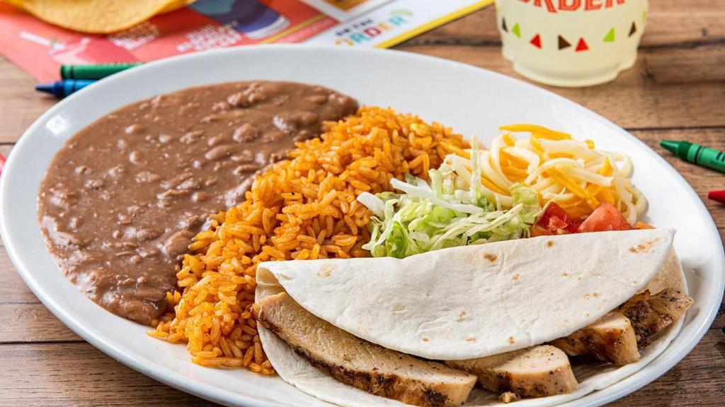 Kids Grilled Chicken Soft Taco · Mesquite-grilled chicken in a flour tortilla. Served with mixed cheese, lettuce, tomatoes, Mexican rice and refried beans.