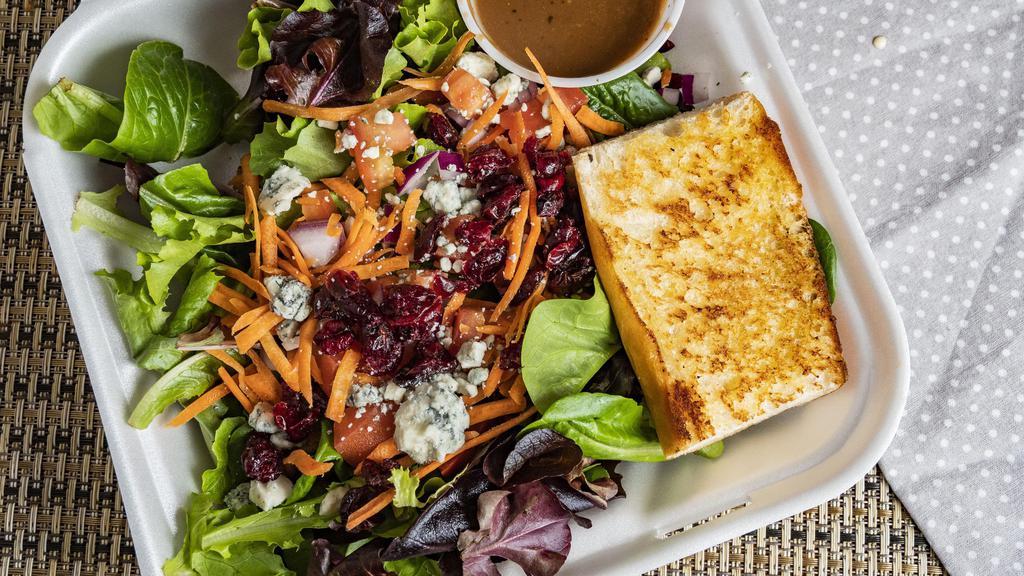 Wood Fire Grill Salad · Mixed greens, tomatoes, carrots, blue cheese crumbles, dried cranberries, red onion. Tossed in balsamic vinaigrette.