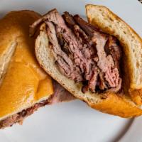Signature Tri-Tip · Thin sliced tri-tip on a toasted hoagie roll, side of BBQ sauce.