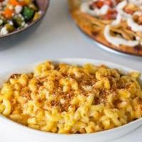 Macaroni And Cheese Pasta · Macaroni, Cheddar, Alfredo Sauce, Topped with Breadcrumbs, & Parmesan.