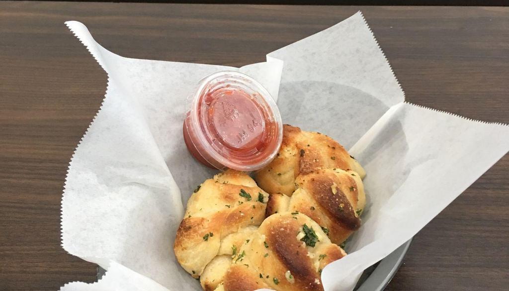 Garlic Knots · 4 House-made Deliciouse Rolls with a side of Marinara Sauce.