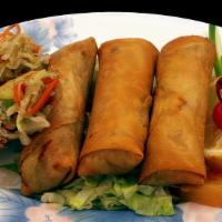 Crispy Vegetable Egg Roll 春卷 · Four pieces. Cabbage, celery, and carrots wrapped in egg roll skin, deep fried until golden ...