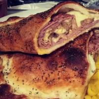 Stromboli · Salami, sausage, ham, cheese, mustard, inside baked and seasoned dough, served with marinara...
