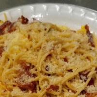 Spaghetti Carbonara · Tossed in olive oil with bacon pieces, egg, crushed red pepper, and Parmesan cheese.