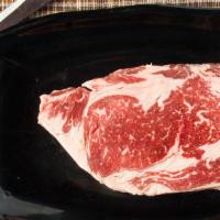 Rib Eye Steak (Fresh Uncooked Meat) · Rib eye - tender steak meat served with butter & rosemary sprig.