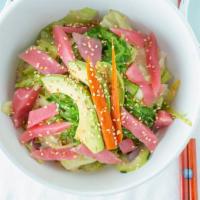Poke Tuna Salad · Tuna, avocado chopped white onion, kelp, and cucumber with Hawaiian dressing.