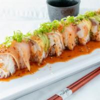 Dj Ashba Roll · Spicy yellowtail, cream cheese and cucumber inside, topped with albacore, avocado, and spicy...