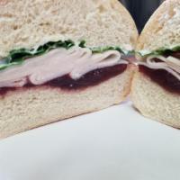 Turkey Cranberry · Turkey, smashed cranberries, mayo and lettuce. Doesn't have mustard.