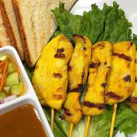 Sate Chicken · Sliced chicken on skewers, marinated in thai spices and coconut milk. Grilled and served wit...
