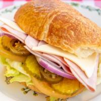 Turkey & Swiss Cheese Sandwich · Mayo, mustard, lettuce, tomato, onion, pickles, jalapeño.
