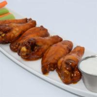 Mango Habanero Wings · Jumbo Bone In wings marinated overnight, slow cooked, then deep fried golden brown and tosse...