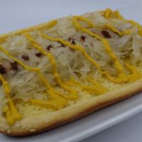 Gourmet Bratwurst · A gourmet bratwurst on a soft bun with sauerkraut and mustard.