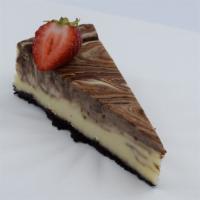 Chocolate Cheesecake · A rich classic decadent blend of smooth chocolate cheesecake on a chocolate crust.