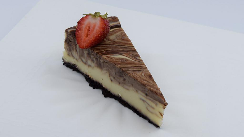 Chocolate Cheesecake · A rich classic decadent blend of smooth chocolate cheesecake on a chocolate crust.