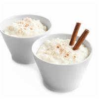 Rice Pudding · Tasty basmati rice cooked with sweet milk, cashew nuts and raisins.