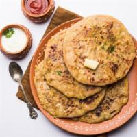 Cheese Naan · Naan bread stuffed with white cheese, paneer, herbs and mild spices.