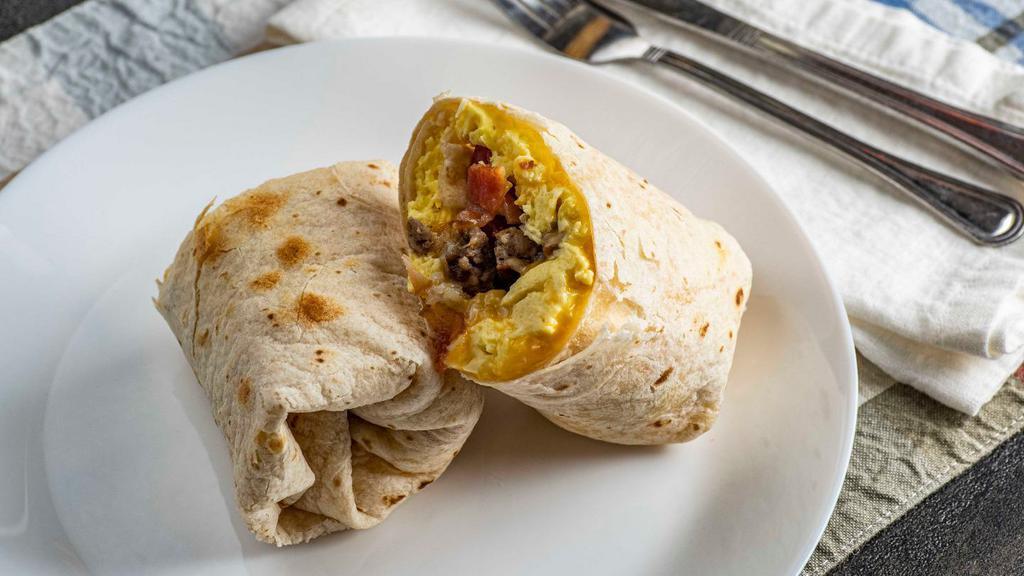 Breakfast Burrito · ( choice of bacon, sausage, combo or cheese ) flour tortilla, scramble eggs, hash brown shredded cheese, served with salsa & sour cream.