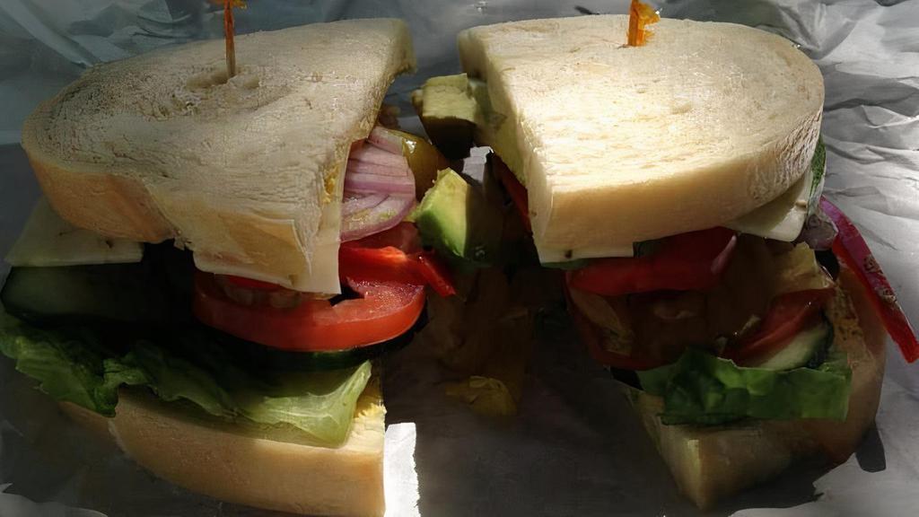 Veggie Panini · Mayo, mustard, lettuce, tomato, bell pepper, onions, cucumber, pickles, peppercinis, avocado, cheese, Choice of breads