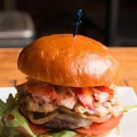 Lobster Surf&Turf Burger · Beef patty with organic greens and tomato, topped with truffle butter poached lobster meat, ...