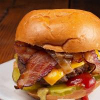 The All American Burger · Angus beef patty, garlic aioli, Cheddar, pickles, bacon, grilled onions, ketchup, and mustard.