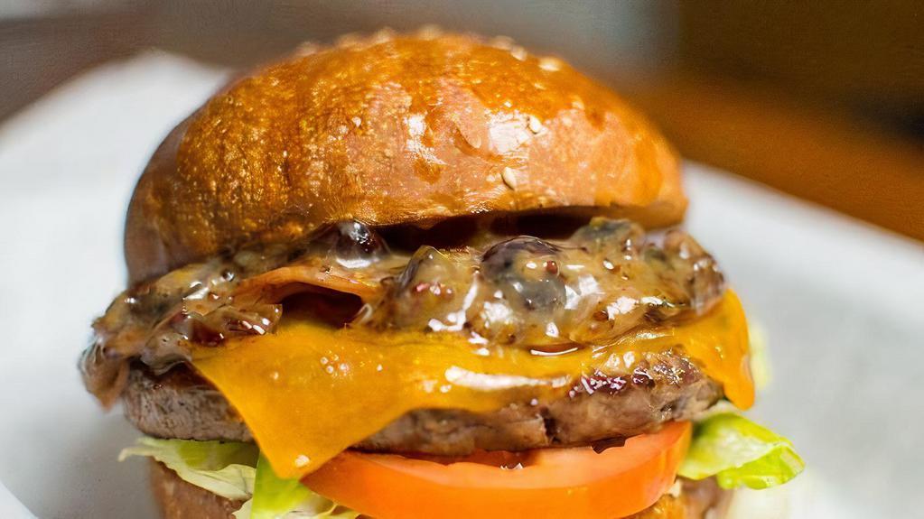 The Canadian Burger · Angus beef patty, garlic aioli, lettuce, tomato, cheddar, Canadian bacon, maple cherry mustard.
