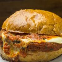 The Italian Burger · Crispy chicken , provolone and Parmesan cheese, topped with garlic tomato sauce and a dollop...