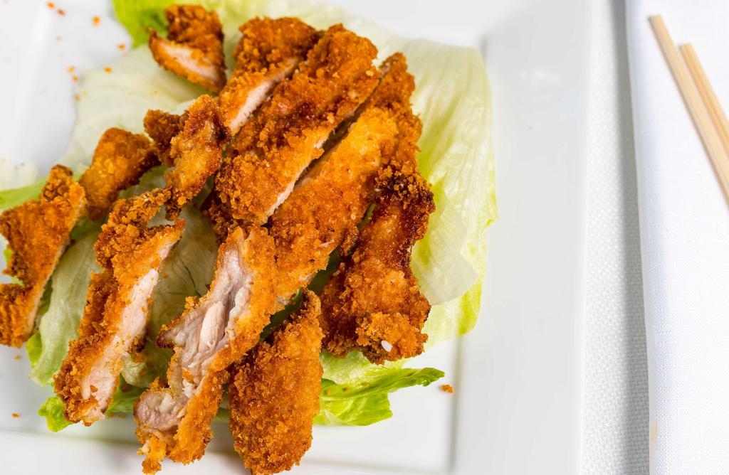Peanut Butter Chicken · Crispy breaded chicken with homemade peanut butter sauce and lettuce. White rice/ fried rice.