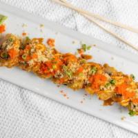 Volcano Roll · Spicy Tuna, avocado and cream cheese deep fried. Topped with spicy mayo, unagi sauce, green ...