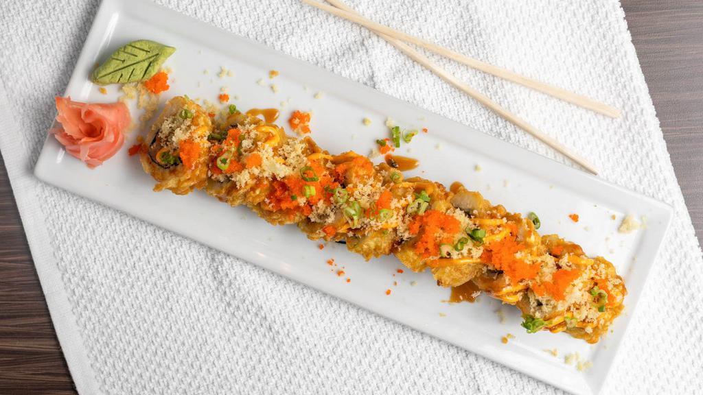 Volcano Roll · Spicy Tuna, avocado and cream cheese deep fried. Topped with spicy mayo, unagi sauce, green onion and masago.