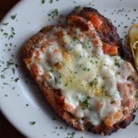 Chicken Parmigiana · Breaded sauteed boneless chicken breast, topped with pomodoro sauce and mozzarella with side...