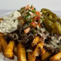 Asada Fries · Meat, fries, refried beans jack cheese or nacho cheese. Pico de gallo, sour cream and jalape...
