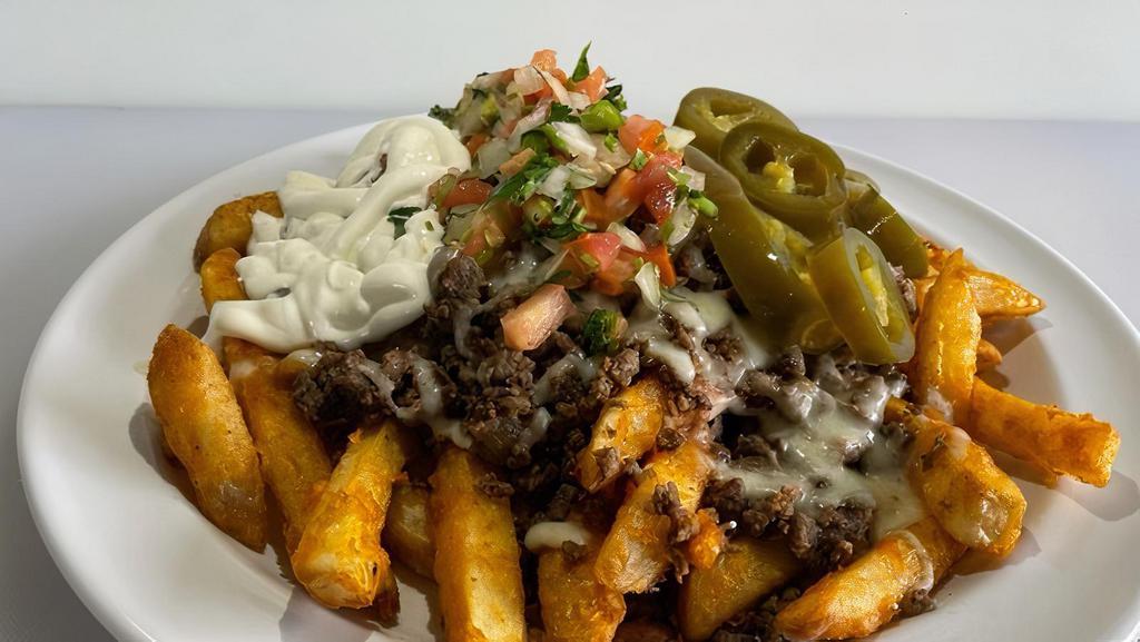 Asada Fries · Meat, fries, refried beans jack cheese or nacho cheese. Pico de gallo, sour cream and jalapenos