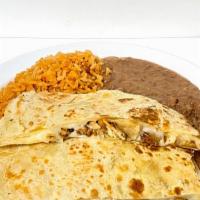 Giant Quesadilla · Large flour tortilla, meat and cheese. served with rice and refried beans