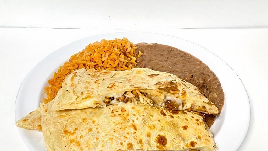 Giant Quesadilla · Large flour tortilla, meat and cheese. served with rice and refried beans