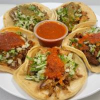Street Taco · One taco small double corn tortilla, meat, onion, cilantro and salsa