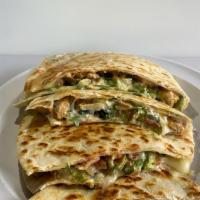 Super Quesadilla · Large flour tortilla, meat, cheese, lettuce, sour cream, pico salsa and guacamole. Everythin...